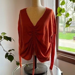 Orange jersey shirt with front adjustable rushing.